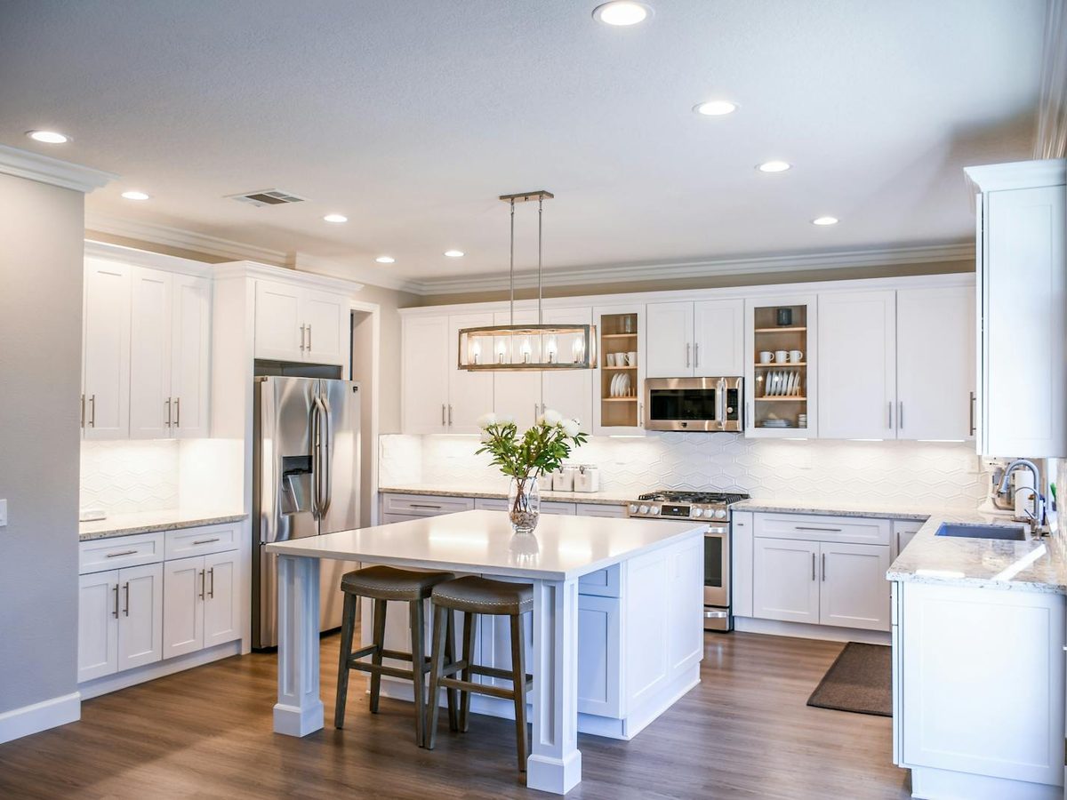 Coastal Hampton Roads home with a prominent two-car garage door — the kind of property exposed to salt air and Atlantic wind