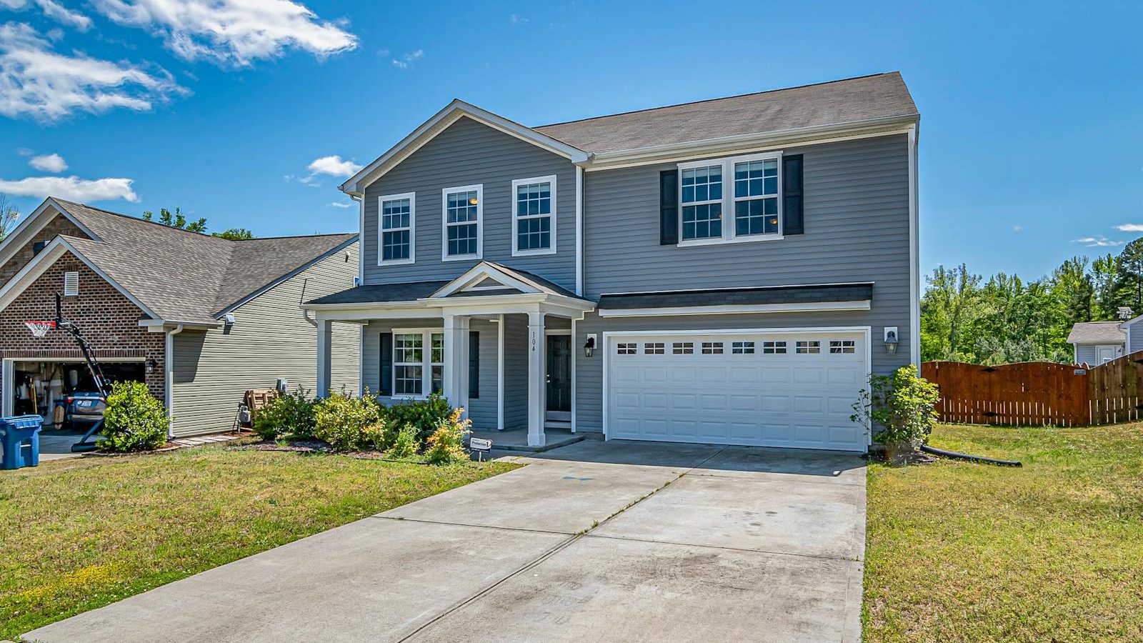 Coastal Hampton Roads home with a prominent two-car garage — the kind of property at the center of the 2026 insurance pullout