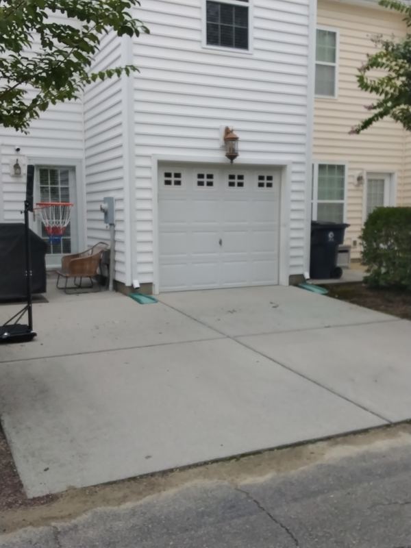 White garage door on white home