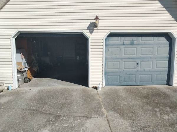 Two new doors installed on brick home