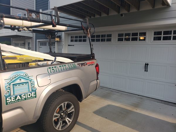 A newly installed wind-rated insulated garage door at a coastal Virginia Beach home, built to meet Hampton Roads hurricane wind-load requirements.
