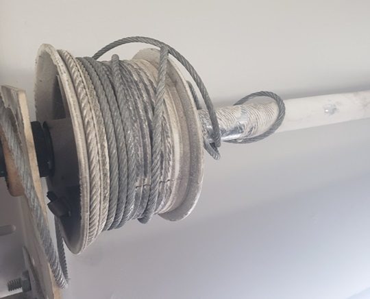 Garage door drum and pulley assembly