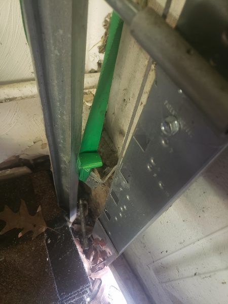 Garage door off its track, emergency repair
