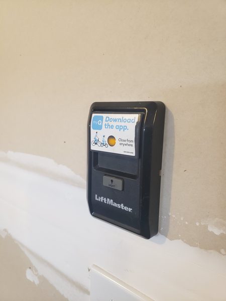 Garage door opener control panel and wall console