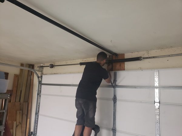 Garage door torsion spring replacement on shaft