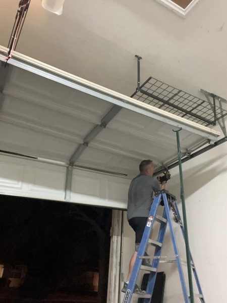 Ronnie fixing an off-track garage door